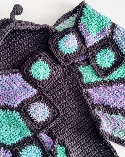 A crocheted butterfly hooded shawl also known as a butterfly blanket.