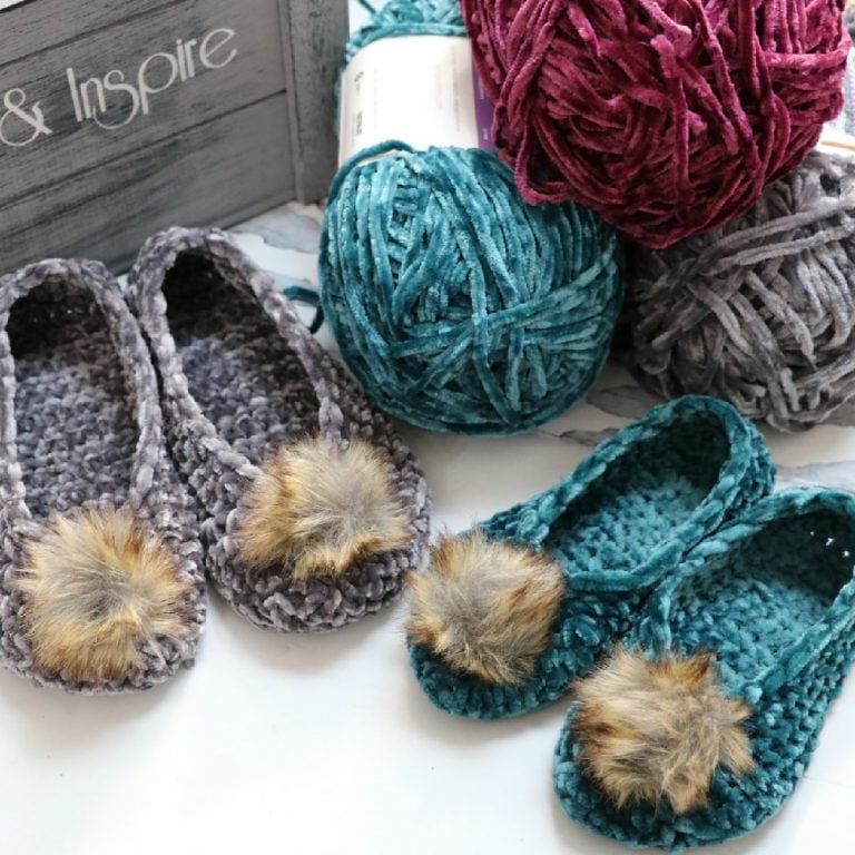 Crochet velvet slippers with pom poms.
