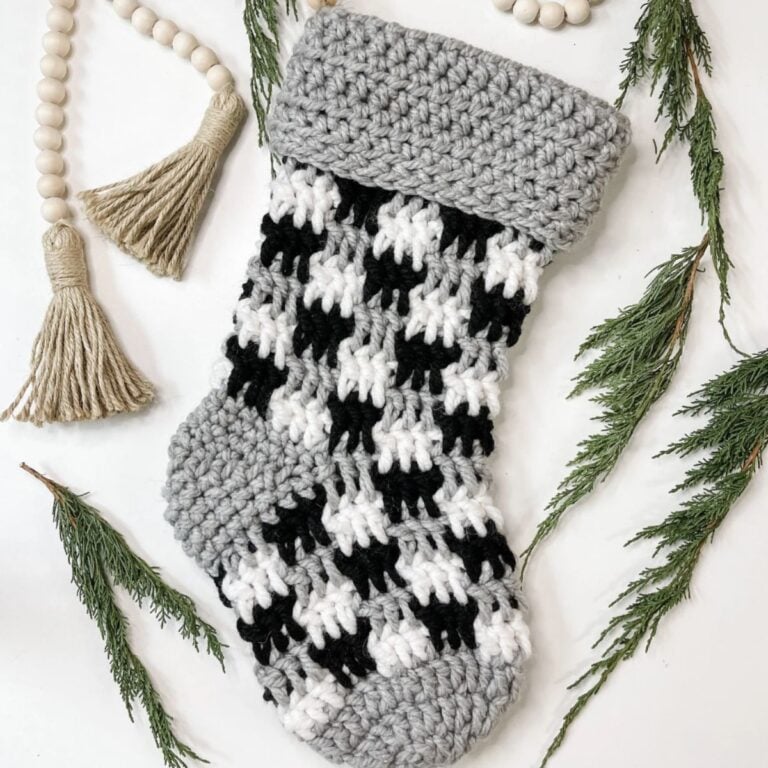 Crochet farmhouse Christmas stocking pattern in houndstooth.