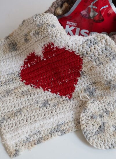 A Crochet Dishcloth featuring a heart motif.
