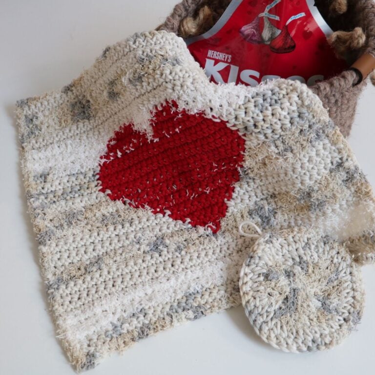 A Crochet Dishcloth featuring a heart motif.
