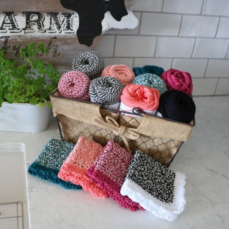 A basket full of colorful Rosy Posy dishcloths and a sign that says farm.