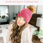 Crochet baby hat pattern featuring a kindred spirit cabled design, with an accompanying video tutorial.