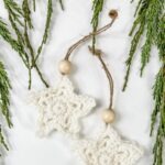 Get a free crochet and video tutorial for creating a mini beaded star, perfect as a crochet star ornament.