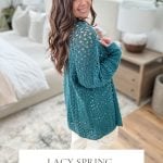 A woman stands in a room, showcasing a teal Crochet Lacy Spring Cardigan. The text reads: "Lacy Spring Cardigan: Crochet Pattern & Video, 2 Piece Construction." The backdrop features a bedroom with white bedding and decor.
