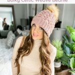 A woman wearing a bulky celtic beanie with the text free pattern and video tutorial.