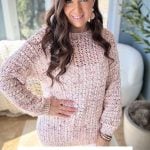 A woman in a pink crochet sweater, reminiscent of the intricate designs of our Lacy Days Kimono, stands indoors with greenery behind her. Text reads: "Gum Drop Pullover, Crochet Pattern & Video, Sizes XS-5X.