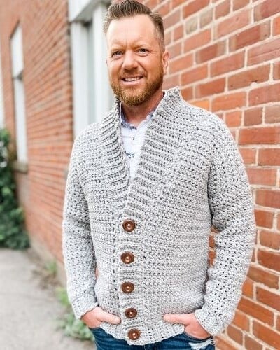 A man wearing a Mountain Ridge Cardigan.