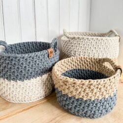 Three Crocheted Baskets on a Wooden Table.