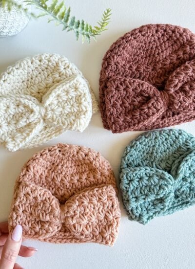 Four crocheted beanie hats, including a Star Stitch Crochet Baby Hat, in different colors.