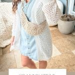 Person wearing a light blue dress, white knit cardigan, and a crochet crossbody bag stands on a tiled floor with a potted plant nearby. Text reads "Granny Style Crochet Crossbody Bag: Pattern & Video.