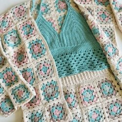 A person is holding a Granny Square cardigan