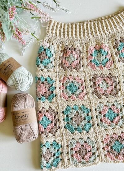 A crochet skirt adorned with colorful flowers.
