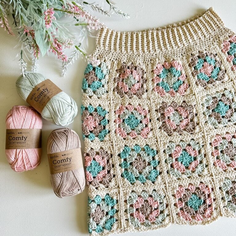 A crochet skirt adorned with colorful flowers.