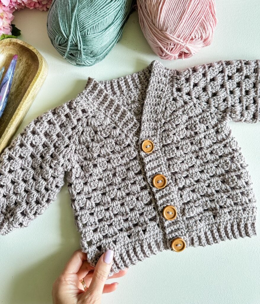 A wooden box filled with different colors of yarn, perfect for creating a stunning waffle stitch blanket.