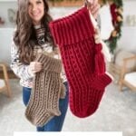 Woman holding two crocheted stockings, one red and one beige, in a living room decorated for the holidays with a granny square ornament. Text reads, "Snuggle Season Stocking Crochet Pattern & Video.