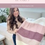 Woman holding a striped crochet blanket in cream, pink, and mauve colors, standing in a living room decorated with a cozy granny square ornament. Text reads "Snuggle Season Blanket—mjsoffthehookdesigns.com.