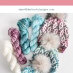 Three knit beanies with faux fur pom-poms are displayed alongside skeins of yarn in shades of white, pink, turquoise, and blue. A charming Granny Square Ornament adds a touch of handmade flair. Text reads "Bulky Mosaic Beanie Crochet Pattern & Video.