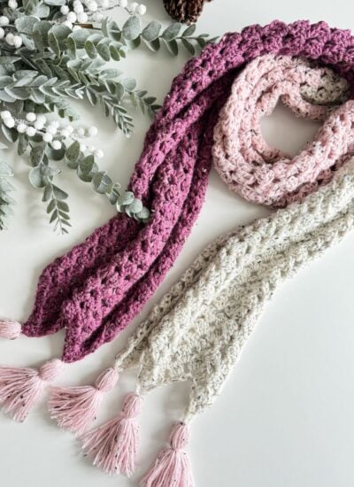 Two Granny Stitch scarves with tassels on them.