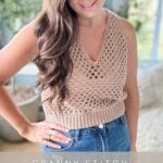 A woman wearing a crocheted tan tank top and blue jeans stands in front of a blurred indoor background. The text overlay reads "Granny Stitch Crochet Tank Top Pattern." Perfect for any crochet tank top enthusiast looking to add a chic, handmade touch to their wardrobe.