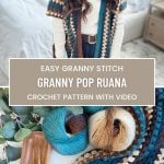 A woman dons a crocheted ruana in a room where colorful yarn and crochet tools are spread out on a table. The text reads "Easy Granny Stitch: Granny Pop Ruana - Free Crochet Pattern with Video.