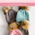 Four cozy Snowy Season Sweater knitted hats with faux fur pom-poms in gray, blue, pink, and taupe are displayed overlapping on a white background.