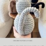 Three Crochet Cat figures in gray, brown, and black yarn are displayed on a wooden table, showcasing the charming "Rustic Farmhouse Cat" pattern by mjsoffthehookdesigns.com.