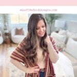 Woman wearing a striped crocheted ruana stands in a bright living room. Text on image reads "The Suzette Ruana" with website "mjsoffthehookdesigns.com," part of our elegant Suzette Raglan-inspired collection.