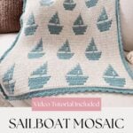 A crocheted blanket with a blue sailboat mosaic pattern draped over a couch; text reads "Sailboat Mosaic Blanket Pattern," "Video Tutorial Included," and highlights this as a reversible crochet pattern.