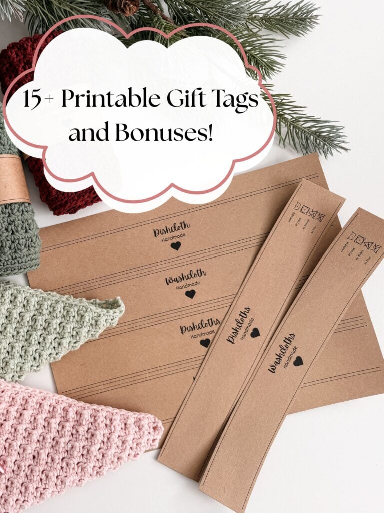 Brown printable gift tags and bands labeled “Handmade with love” are arranged on a white surface with crocheted items and pine branches. Text above reads: “15+ Printable Gift Tags and Bonuses!”.