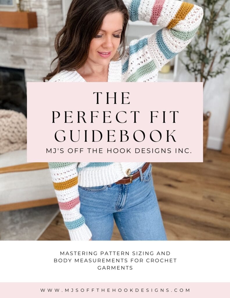 Woman wearing a striped crochet sweater and jeans stands indoors. Text overlay reads “The Perfect Fit Guidebook” for crochet garment sizing and measurements by MJ’s Off The Hook Designs Inc.
