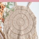 Handmade crochet circle coverup with fringe detailing, displayed flat with yarn and flowers beside it. Text reads: “Circle Coverup Crochet Pattern, Handmade Summer Layer.” This stylish crochet beach cover up pattern is perfect for adding a breezy touch to your summer wardrobe.